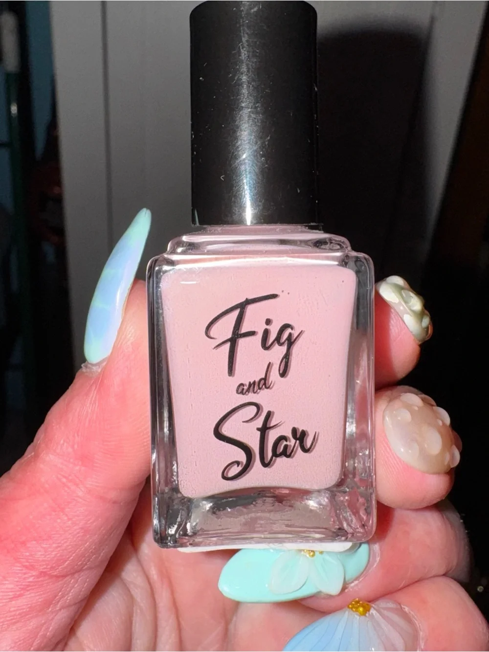 Pale pink nail polish